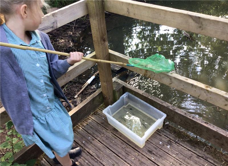 Cranbrook Education Campus student stood with fishing next to lake