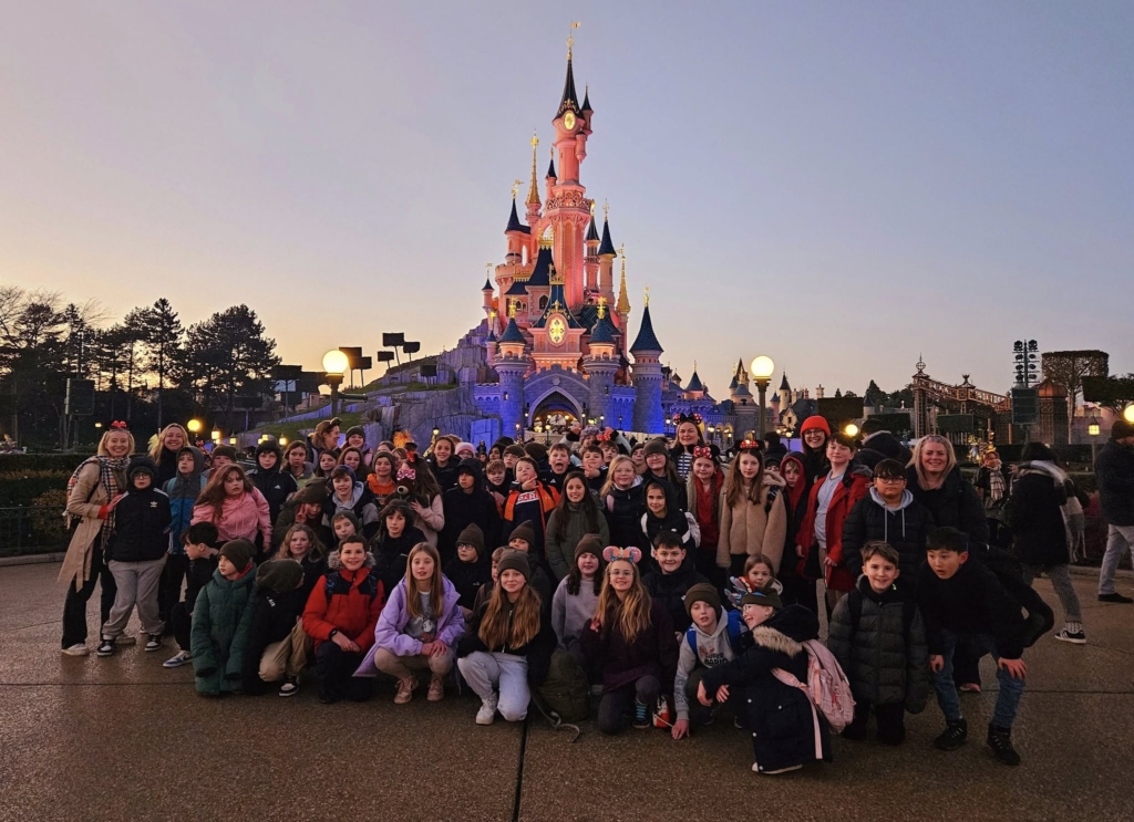 Exwick Heights Primary School stood in Disney Land Paris. 