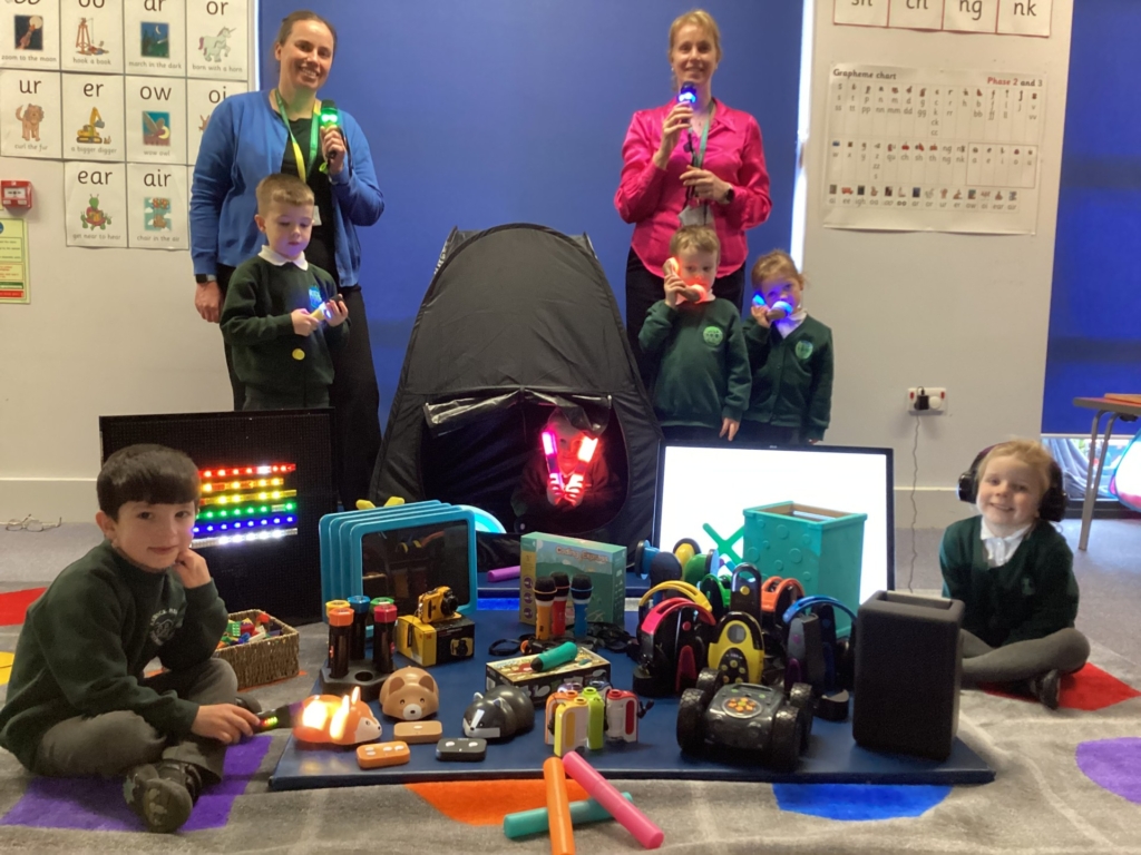 Teachers at Exwick Heights standing in front of various items they have been able to buy from STEM grant. 