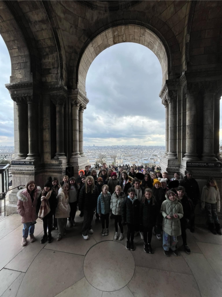 Marine Academy Primary Pupils stood under the Arc de Triomphe