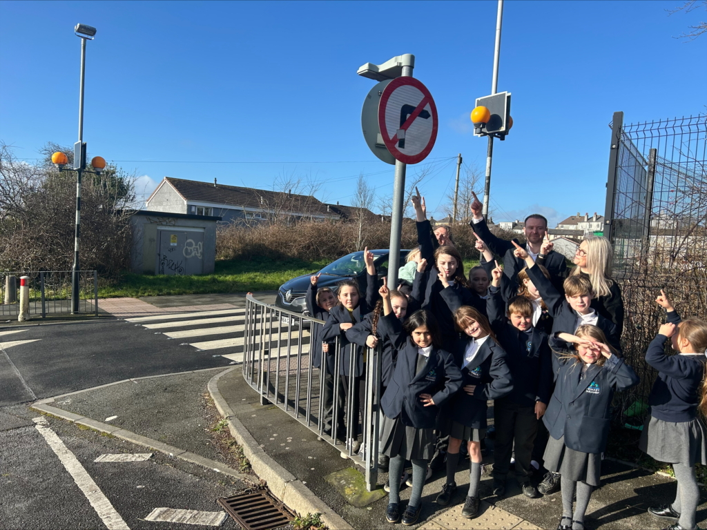 Marine Academy Primary pupils 
out by the side of the road with MP Fred Thomas learning about road safety.