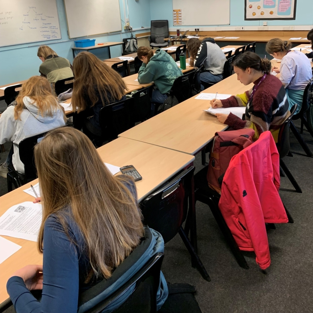 Sixth Form students from QE sat desks taking part in Chemistry Olympiad 