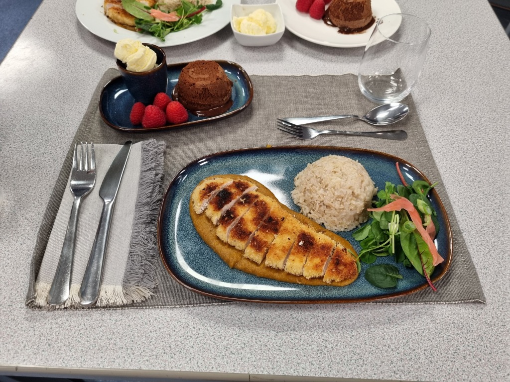 Food laid out ready to serve at the Rotary Young Chef Challenge, rice vegetables and chicken 