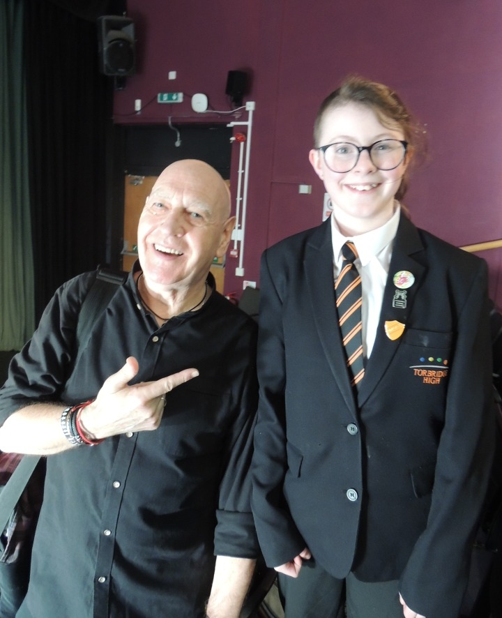 Author Joffre White stood next to a student from To Bridge High