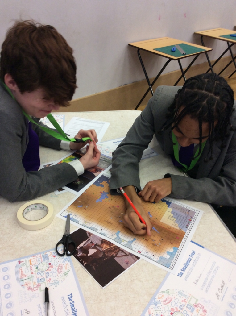 ASAP student sat a table being creative during STEM event