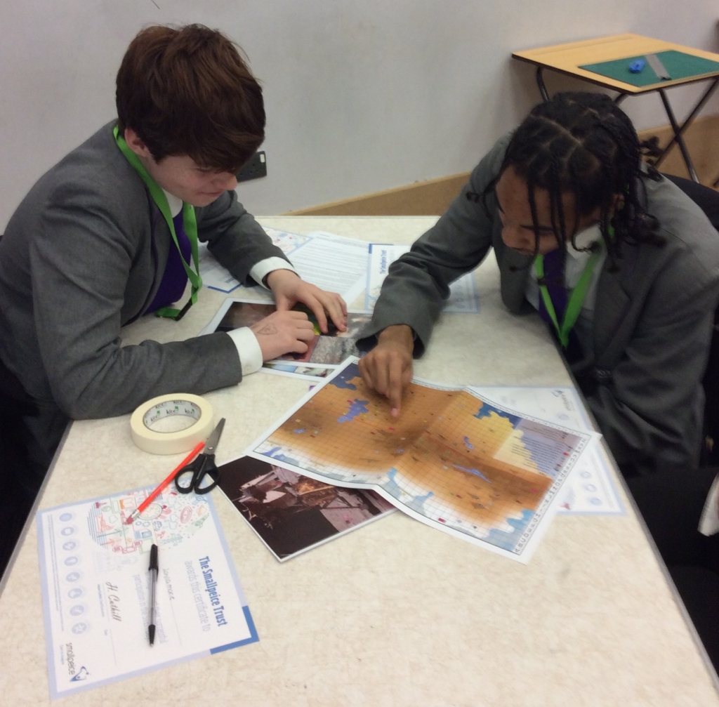 ASAP student sat a table being creative during STEM event