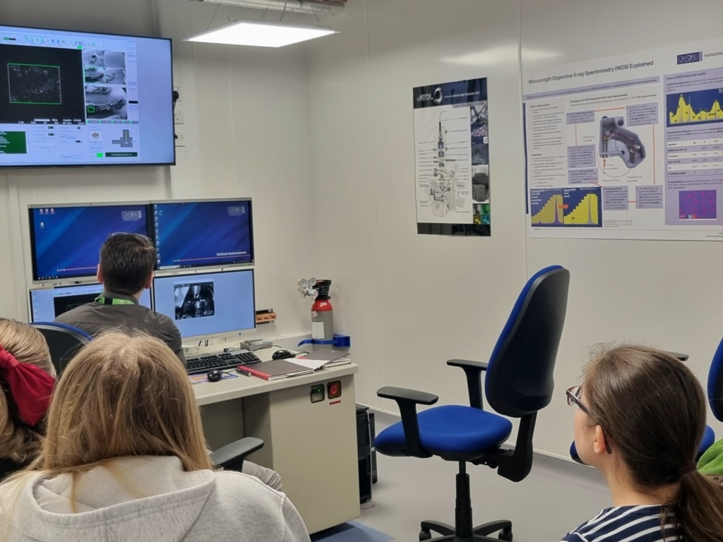 Students from Lipson sat at screens at the at the Plymouth Electron Microscopy Centre