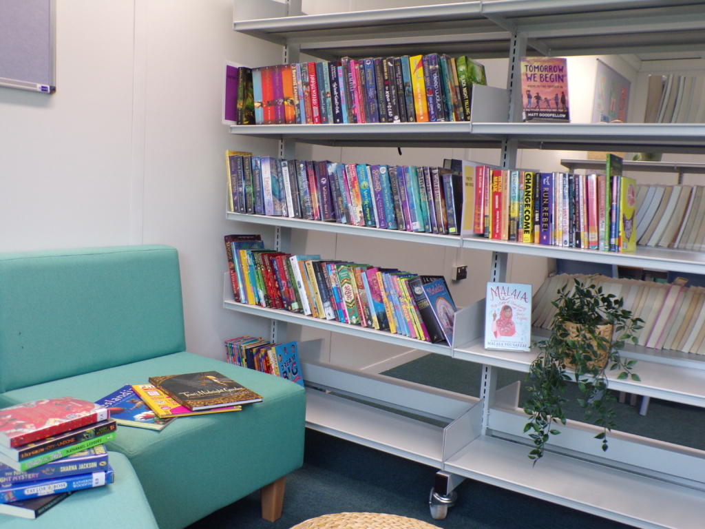 Photo of books on shelves in library