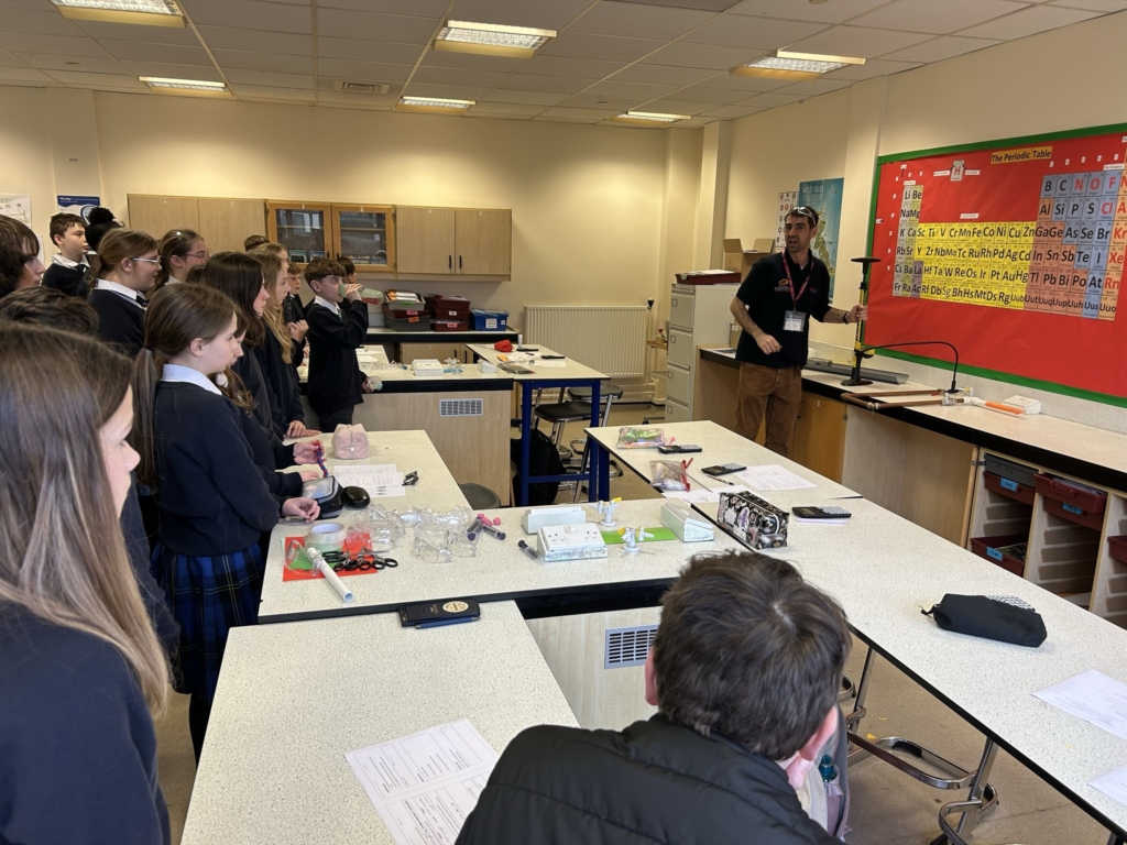 Year 7 and 8  students at West Exe School taking part in hands-on physics activities inside classroom