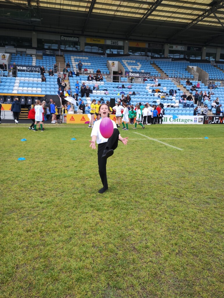 Children from Whipton Barton Federation running around the Exeter Chiefs ground. 