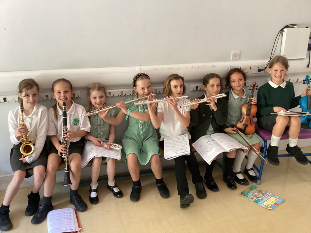 Exwick pupils sat with musical instruments 