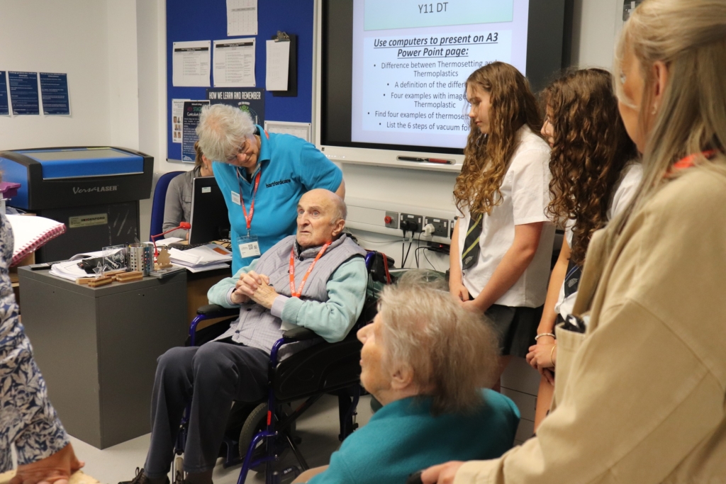 Students from Sidmouth welcoming special guests from Malden House