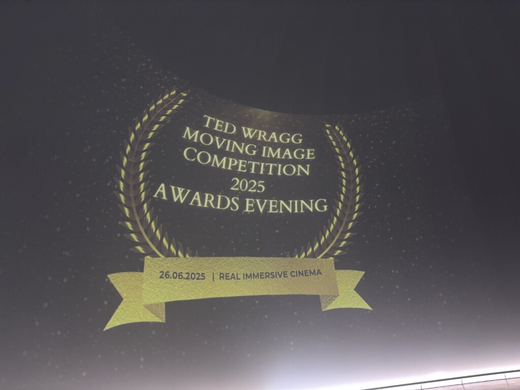Image of screen with a welcome to the awards evening