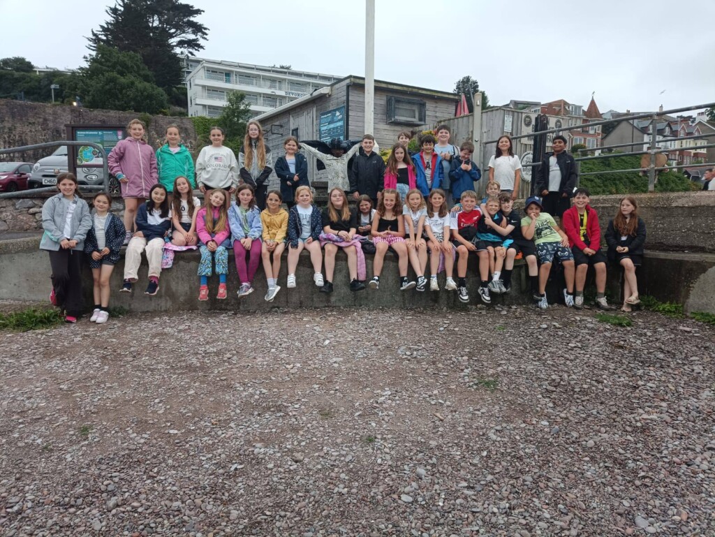 Large group of students pictured on the beach
