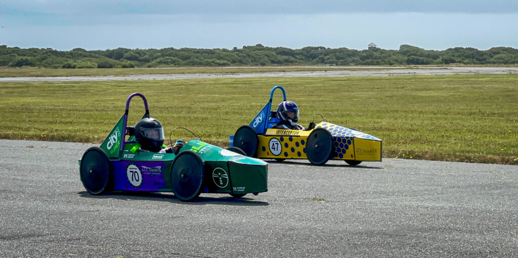 GreenPower engineering and racing team person in car