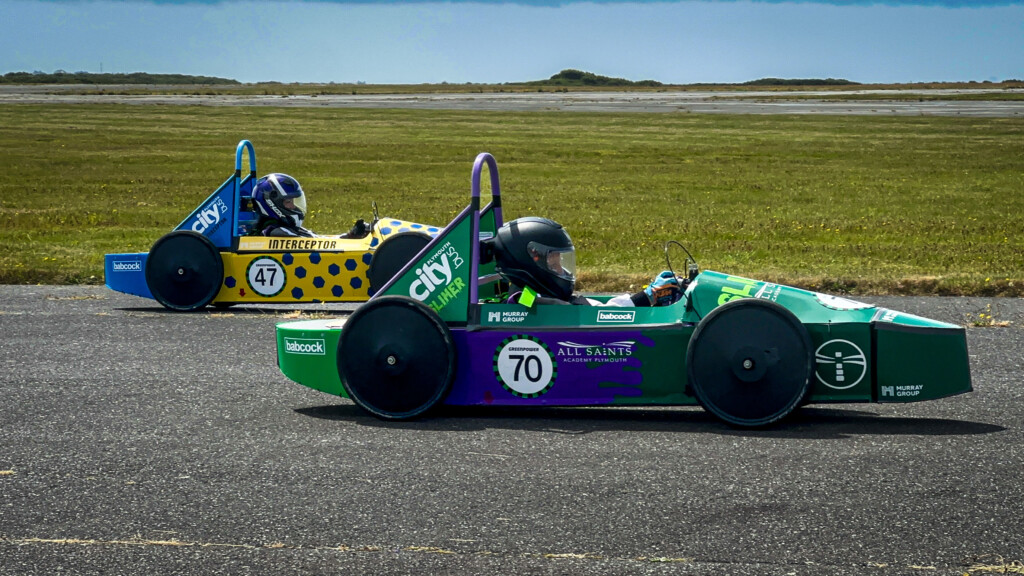 GreenPower engineering and racing team person in car