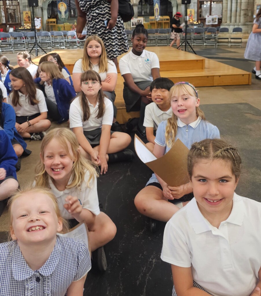 Marine Academy Primary  Children sat in Exeter Cathedral 