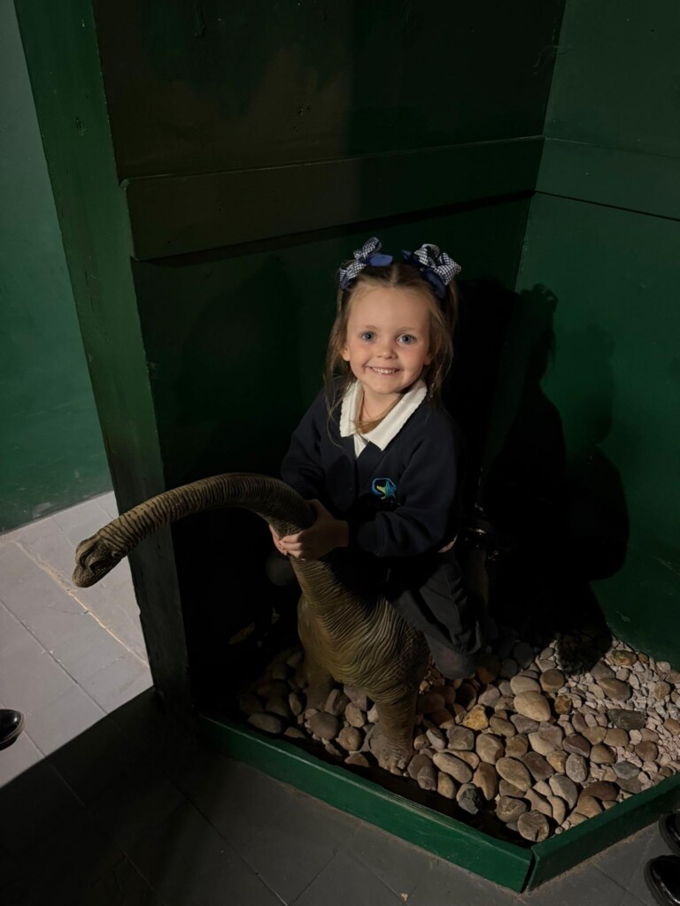 A Marine Academy Primary pupil enjoys Dinosaur World