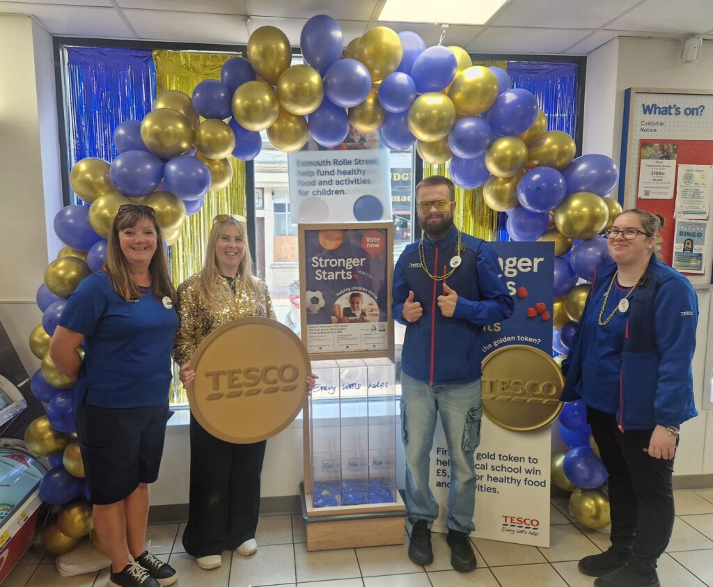 in-store celebrations under a ballon arch