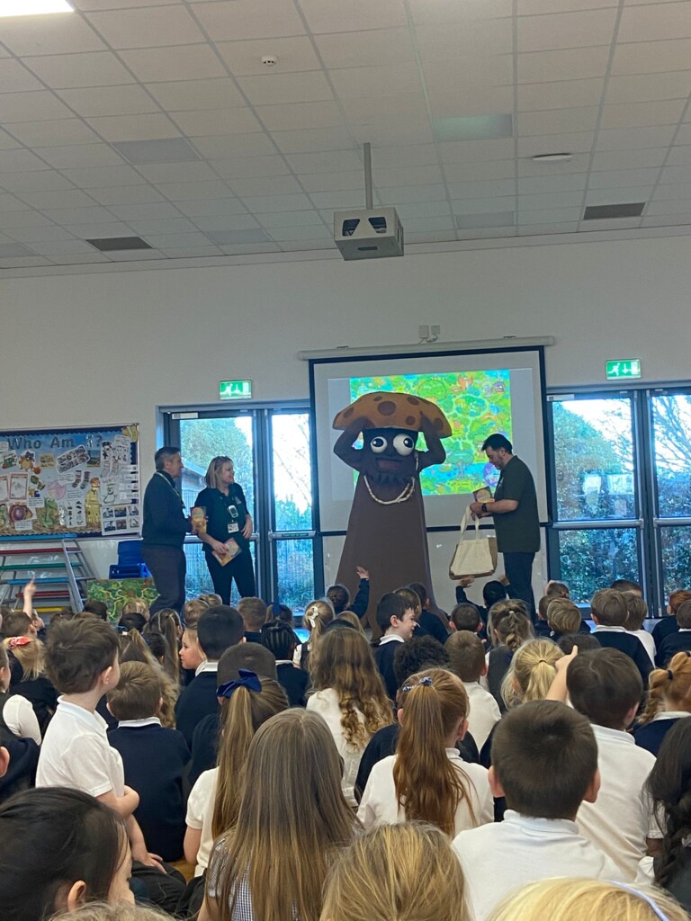 mushi-the-giant-mushroom-takes-assembly-at-marine-academy-primary