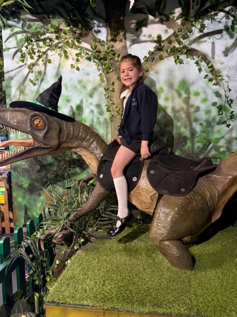 Pupil from Marine Academy Primary Riding a dinosaur