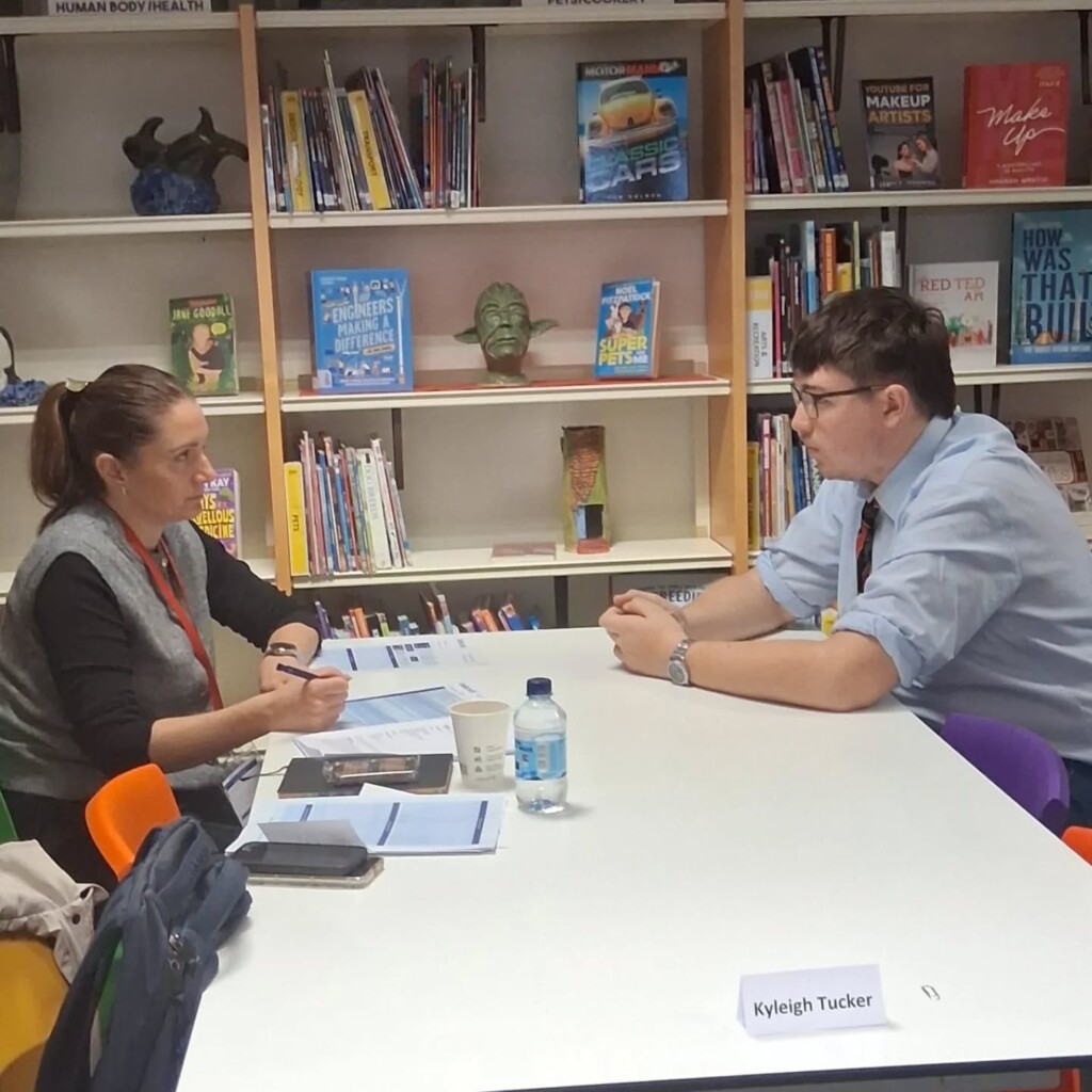 Tor Bridge Hight Students sat doing mock interviews.  