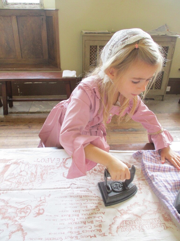 Exwick Heights School Pupil ironing at Powderham Castle