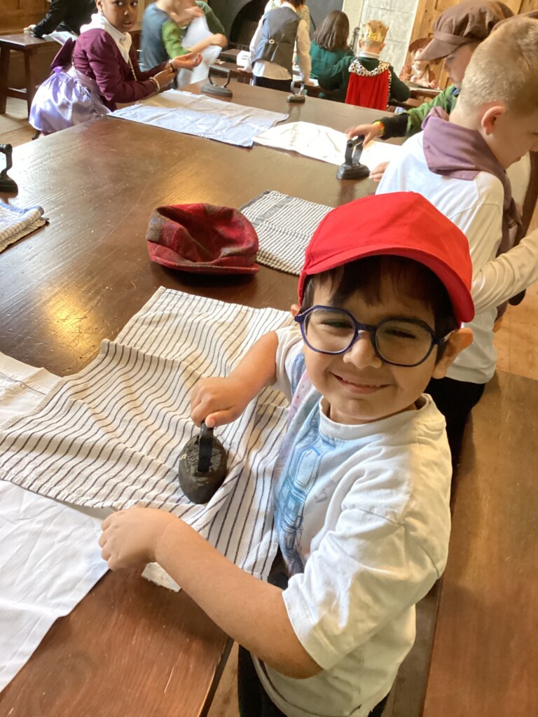 Exwick Heights School Pupil ironing at Powderham Castle