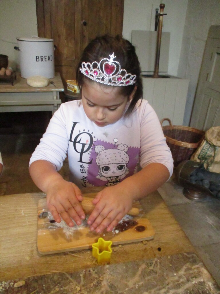 Exwick Heights School Pupil baking in the kitchen at Powderham Castle