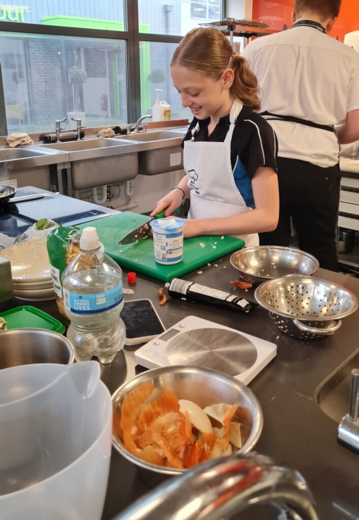 Student Evie from West Exe cooking 