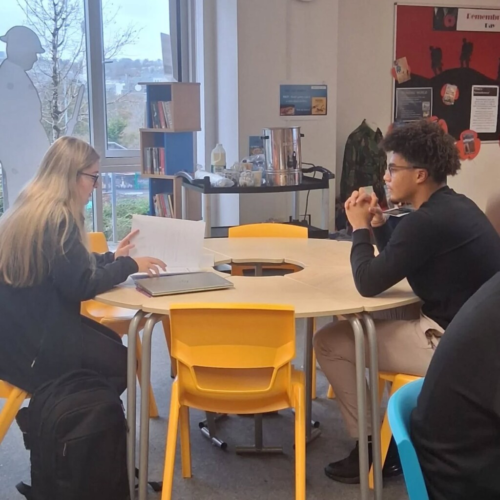 Tor Bridge Hight Students sat doing mock interviews.  