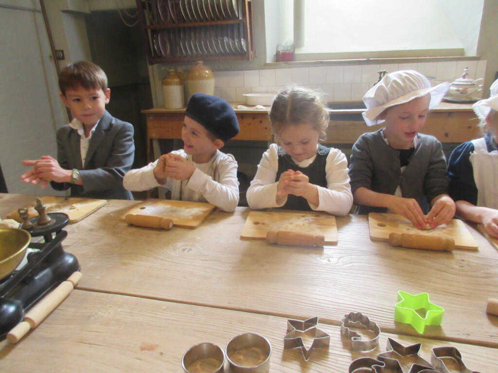 Exwick Heights School Pupils baking in the kitchen at Powderham Castle