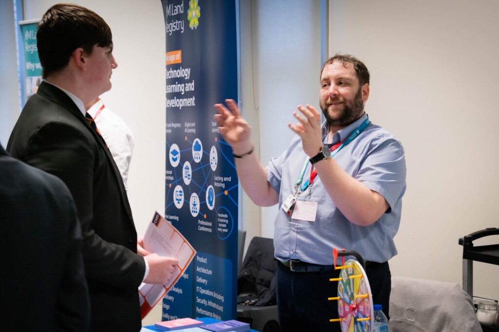 Students from Tor Bridge High talking to employers at careers fair