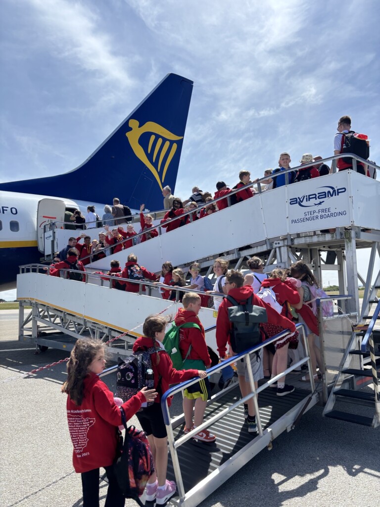 Marine Academy Pupils boaring a plane