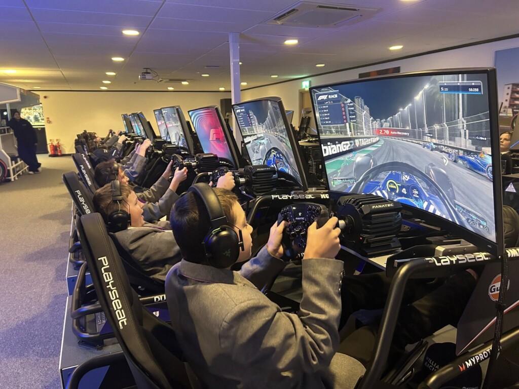 Students competing on F1 simulators