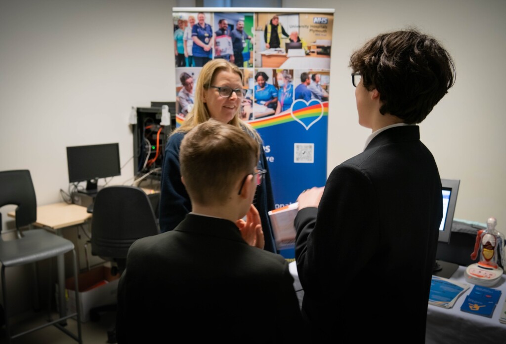 Students from Tor Bridge High talking to NHS employers at careers fair