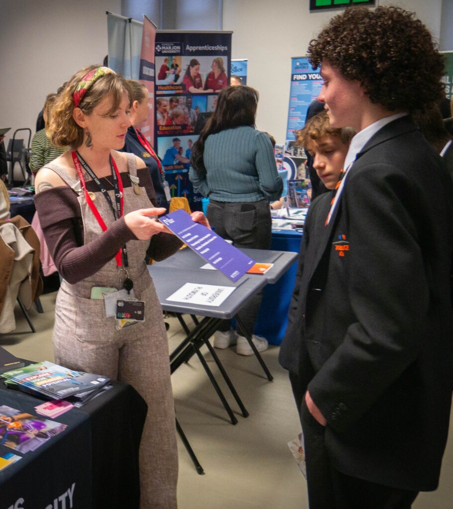 Students from Tor Bridge High talking to employers at careers fair