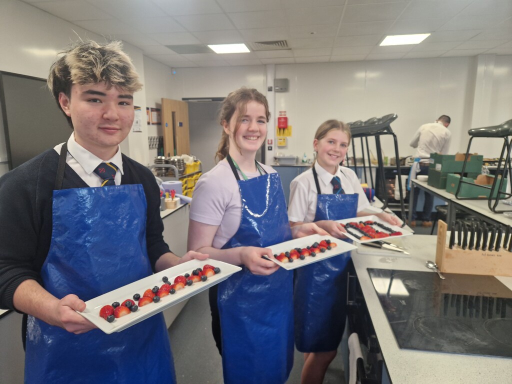 Students shoing food they had preppared