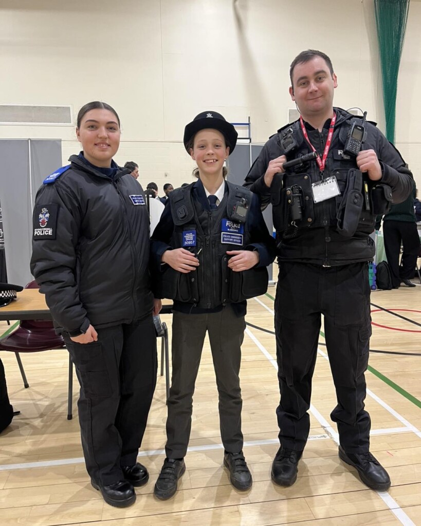 Isca student with local police officers as part of careers fair