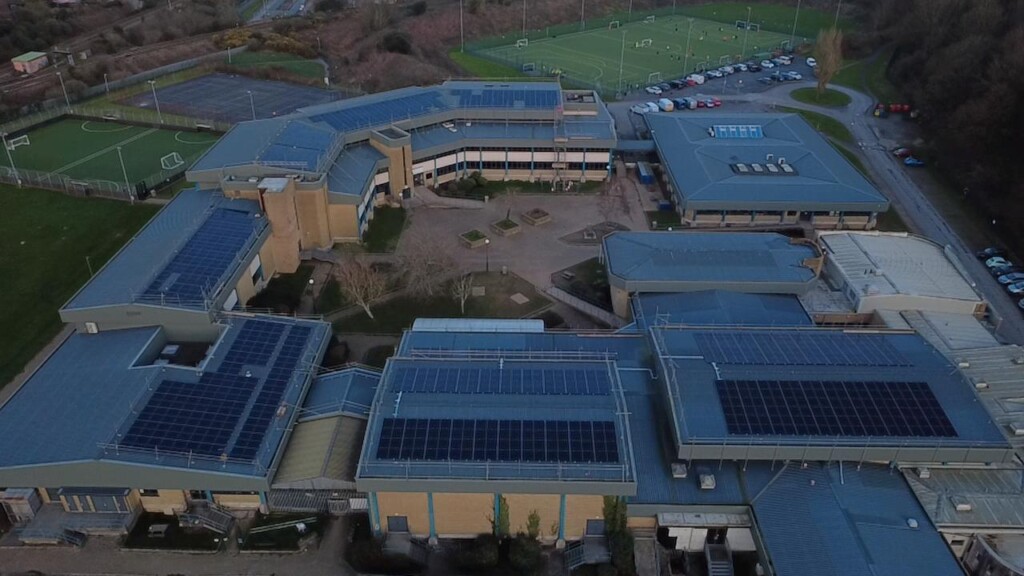 image of Lipson building showing all the solar pannels on the roof. 