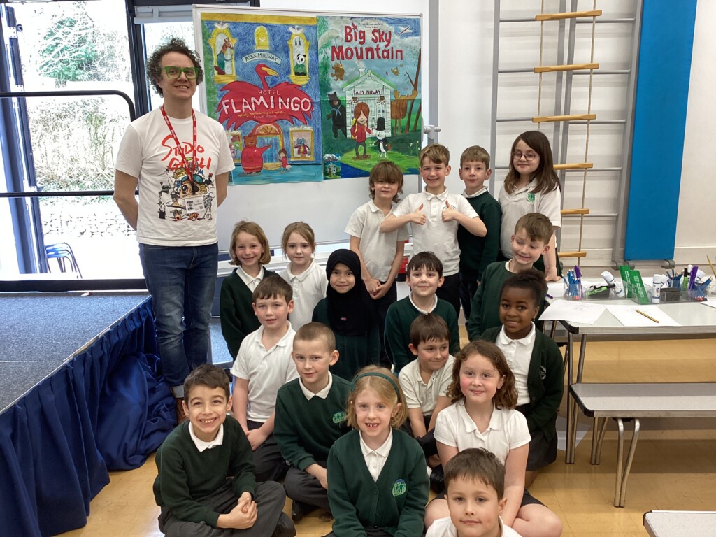 Alex Milway and a class at Exwick Heights pose for a photo