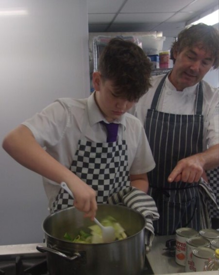All Saints Student learning from the experts