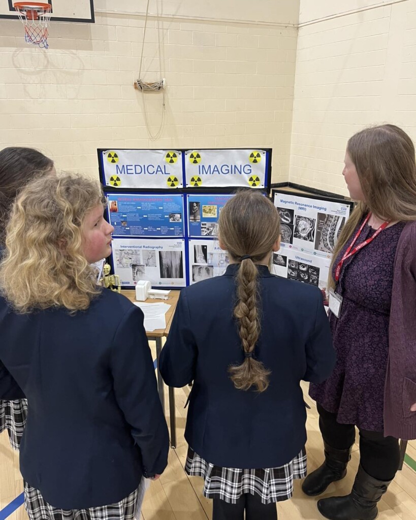 Isca students viewing the medical imaging stand as part of the careers fair