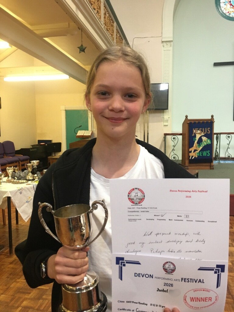 St Luke;s student shows off her winning trophy