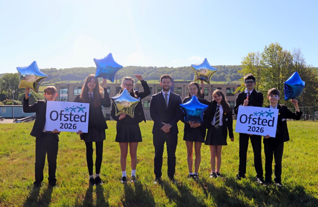 Headteacher Alex and students celebrating Ofsted