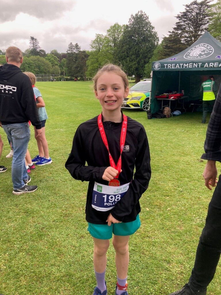 Exwick Heights Pupil Polly with her medal.