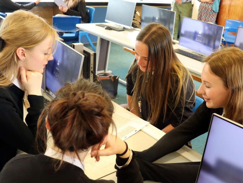Students sat together learning about community journalism. 