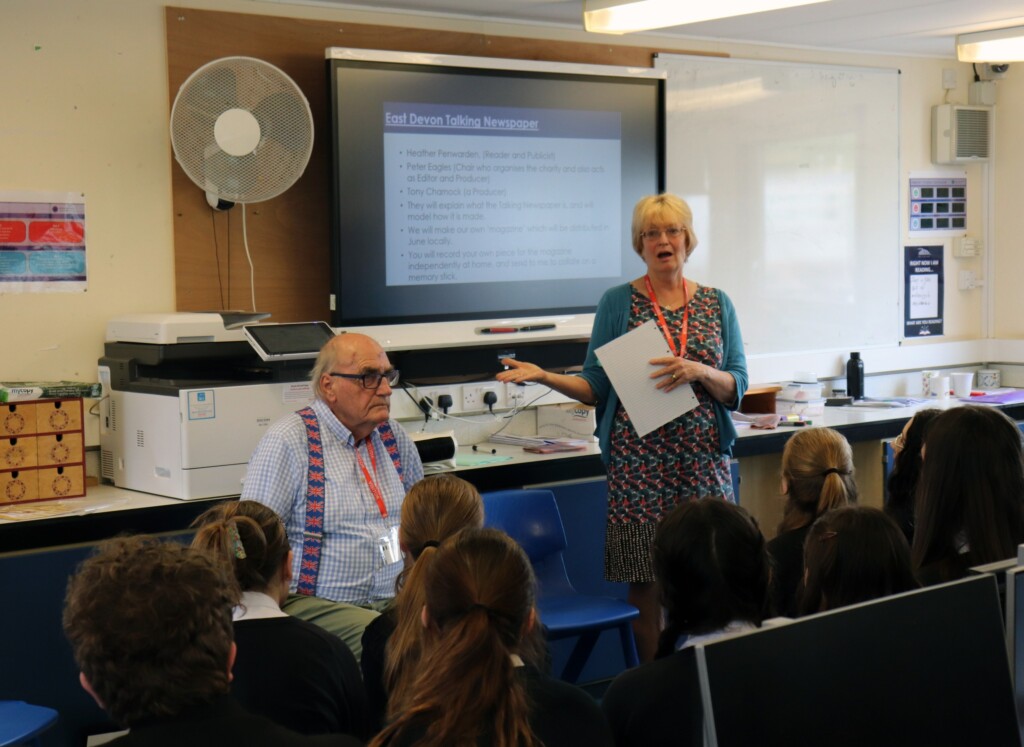 Students listening to a presentation.