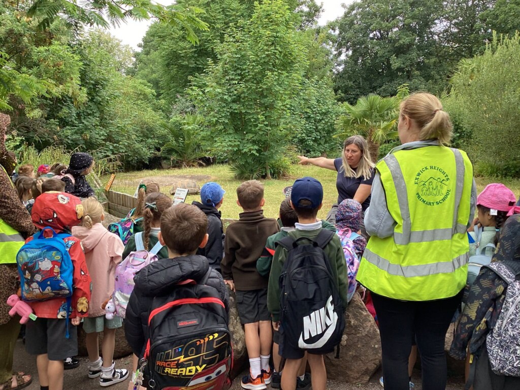 Students listening to a talk at the zoo