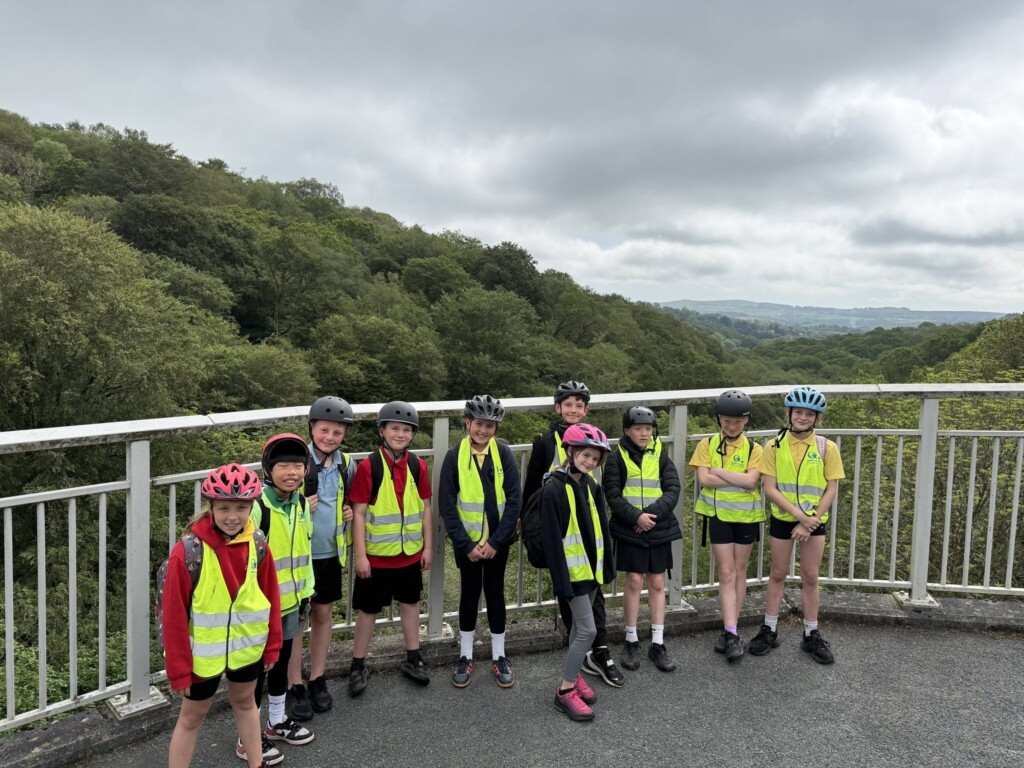 Group of students in their hi-vis and bike helmets